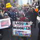 Demonstrators calling for an end to gun violence and the resignation of Chicago Mayor Rahm Emanuel march through downtown on December 31, 2015 in Chicago, Illinois.